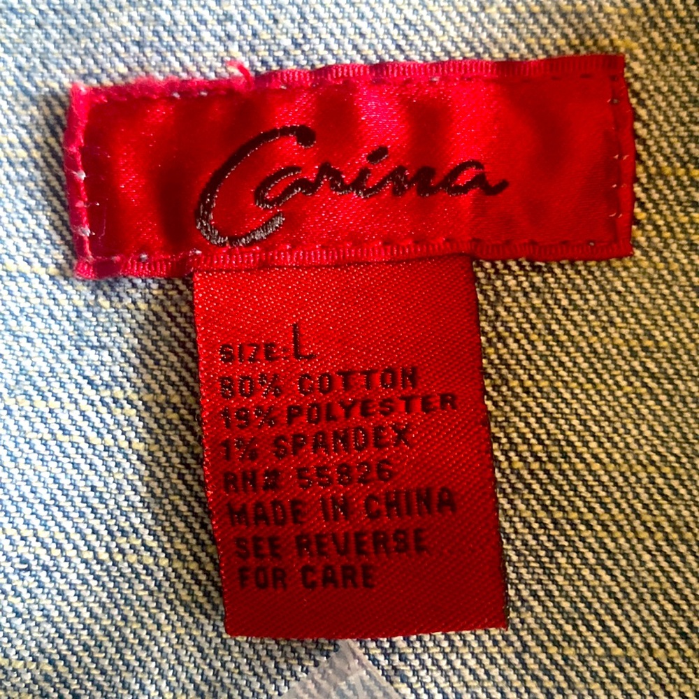 Denim carina jacket with embroidery & sequence detail. Front chest pockets.
